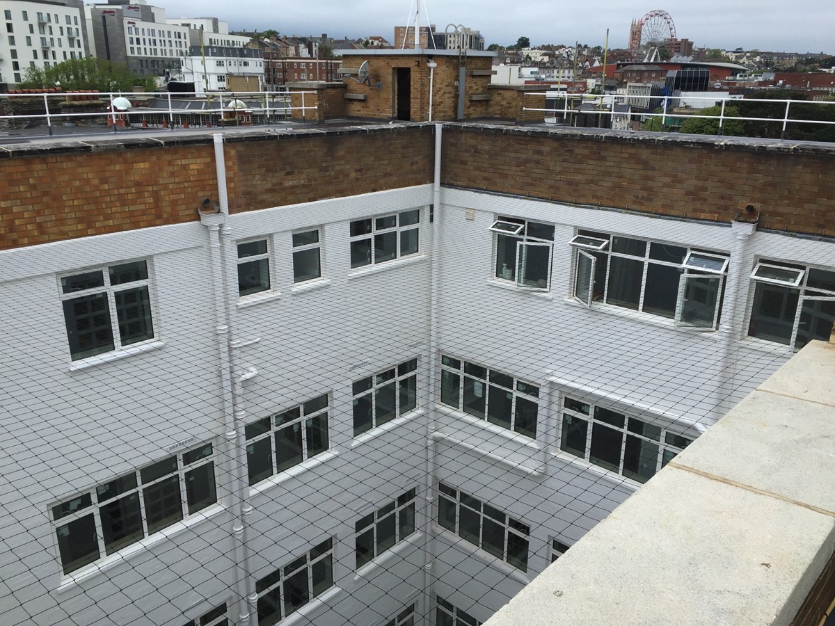 Pigeon netting was installed to a lightwell on the roof of the newly redeveloped Bristol & West house in Bourneouth 