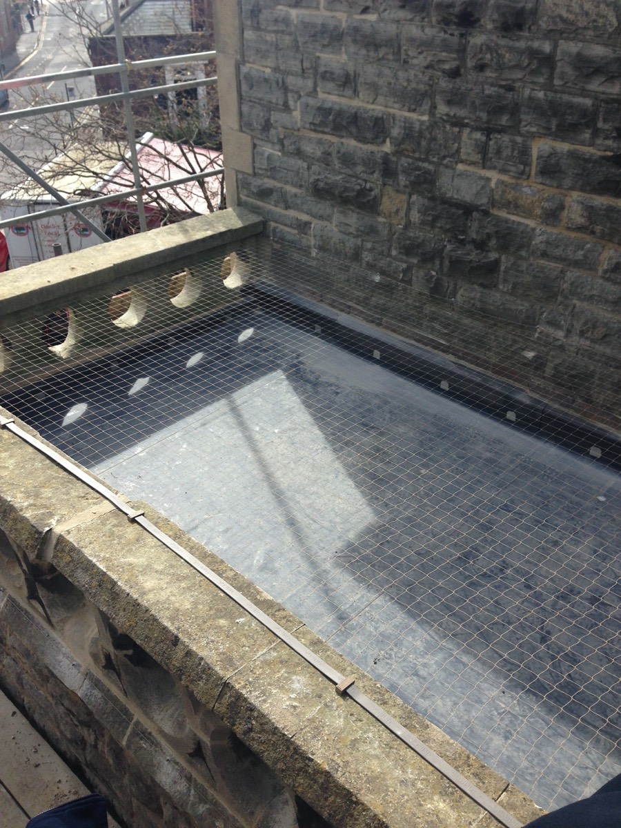 Stone coloured netting was used to prevent Pigeons from landing on the flat roofs at Poole Methodist Church. 