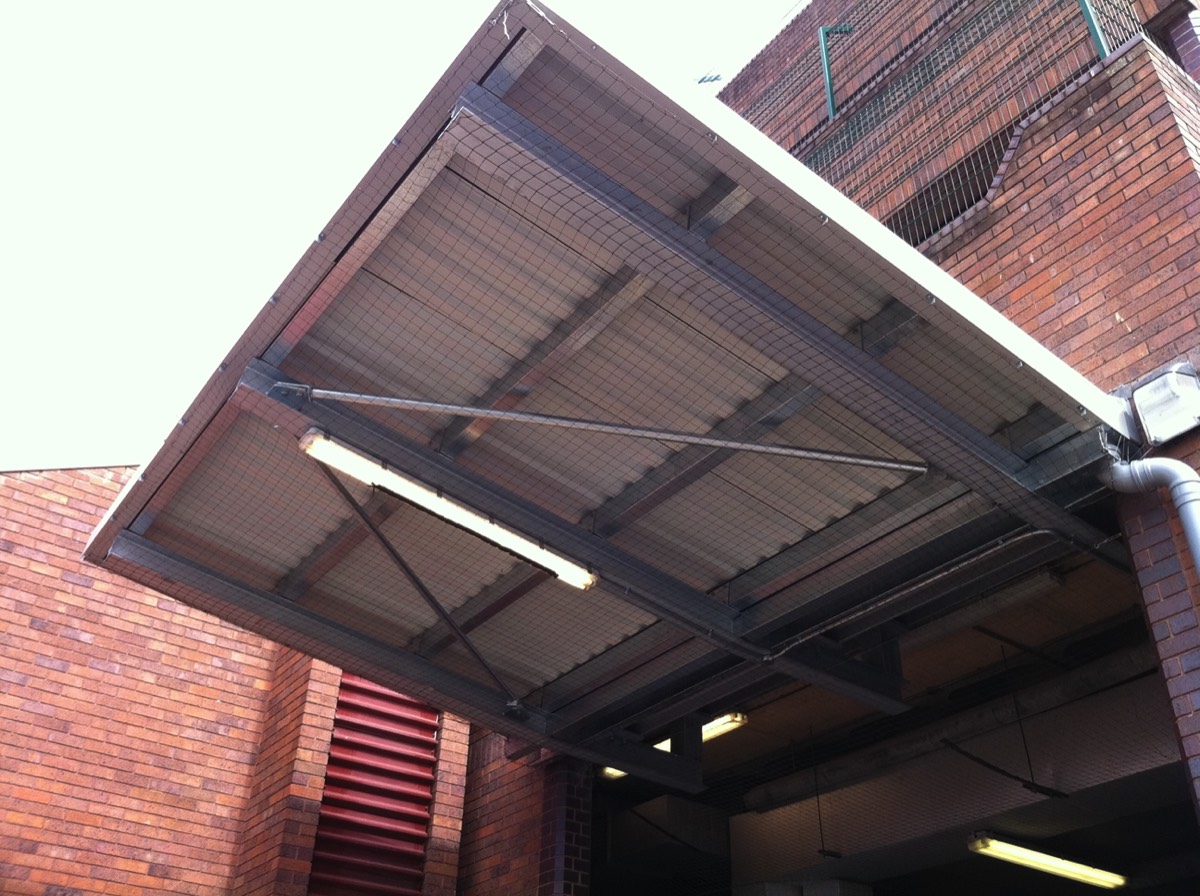 Netting installed to prevent pigeons from perching on this canopy above a loading bay at a shopping centre in taunton. 